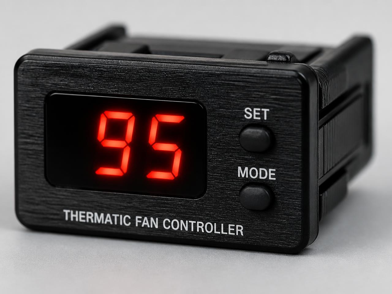 Close-up of the thermatic fan controller LED display and SET / MODE buttons